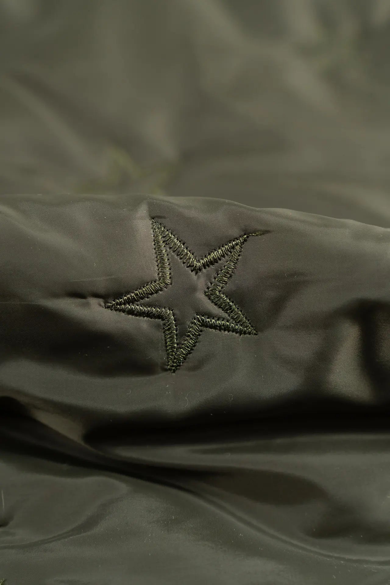 Padding acolchado estrella verde
