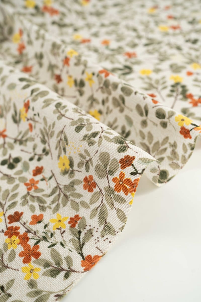 Loneta estampado flores naranja y amarillo mostaza