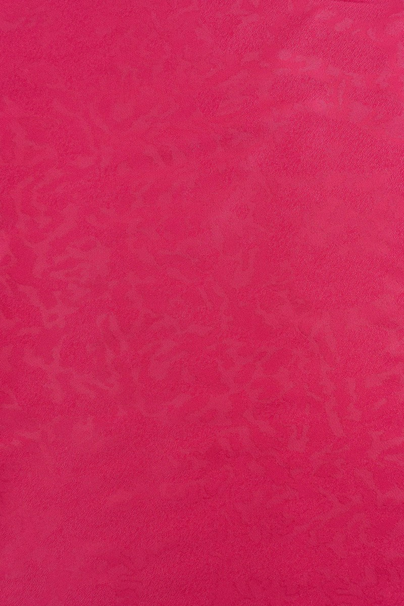 Tejido en color buganvilla con textura ebstracta