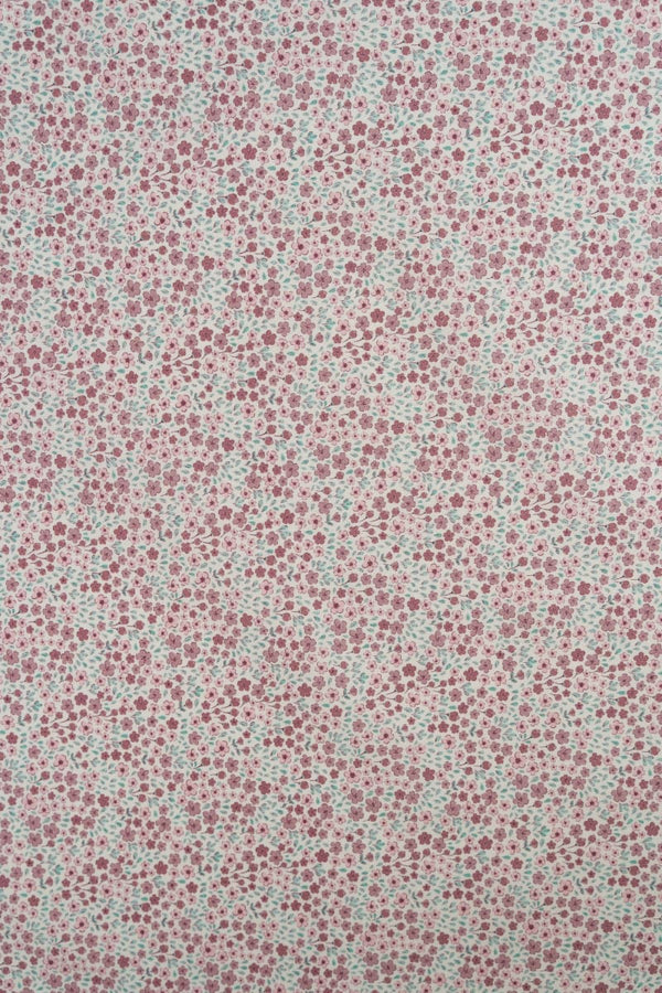Tejido infantil con estampado de flores.