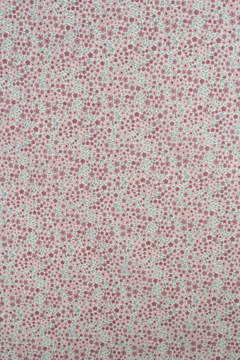 Tejido infantil con estampado de flores.