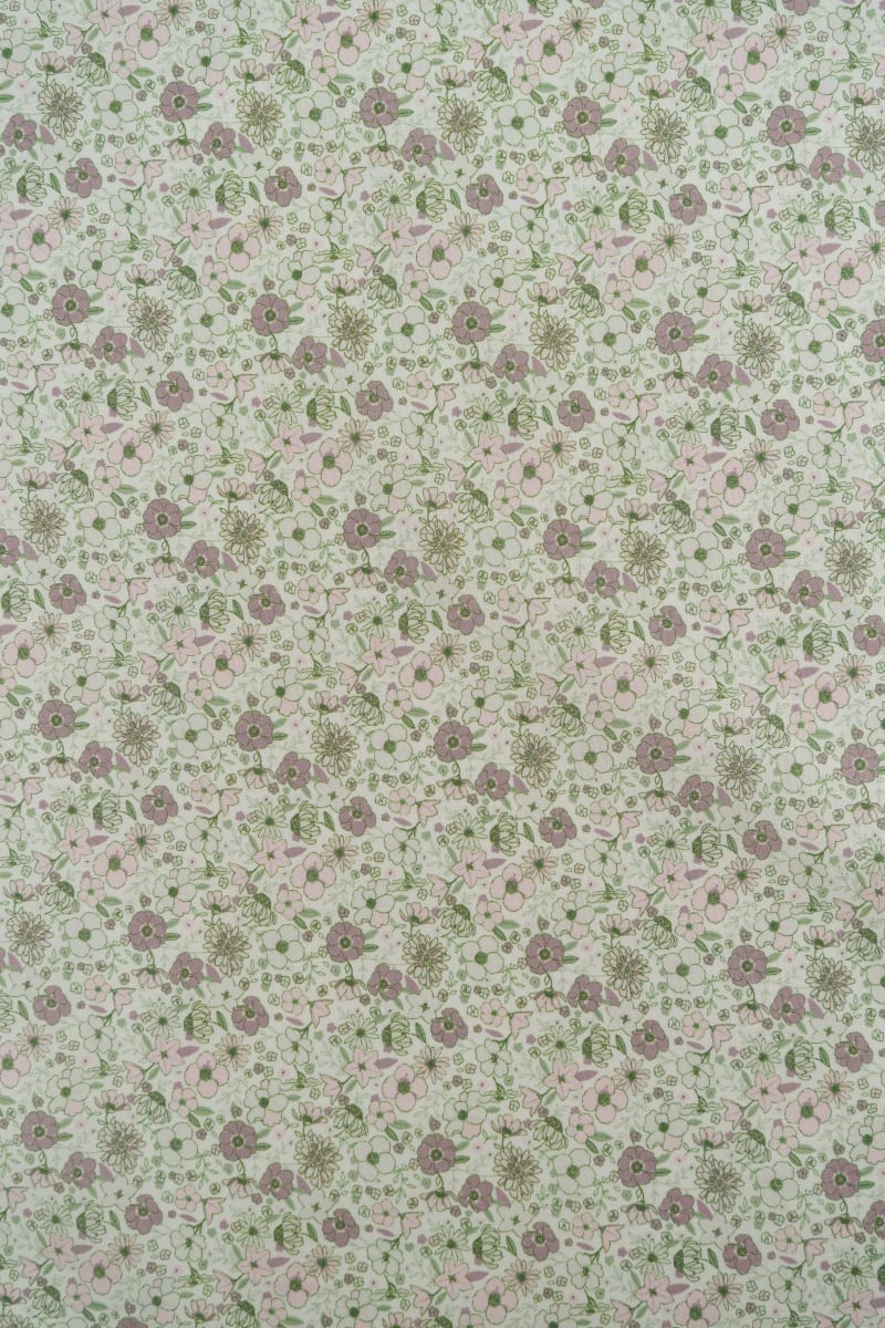Tejido infantil con estampado de flores.