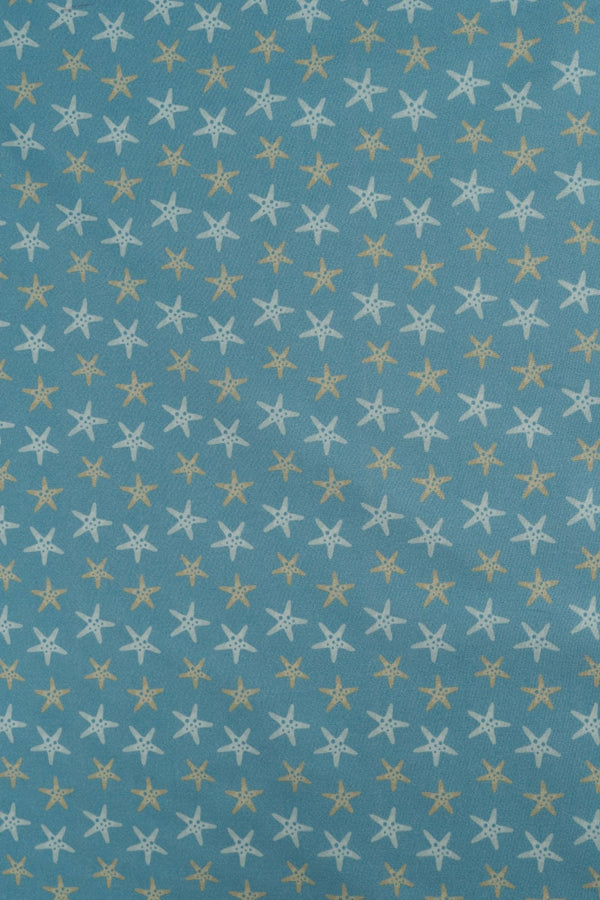 Tejido infantil con estampado de estrellas de mar