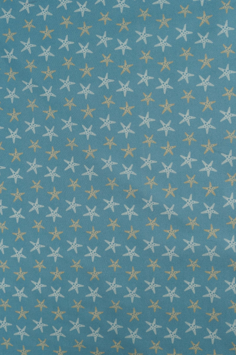 Tejido infantil con estampado de estrellas de mar