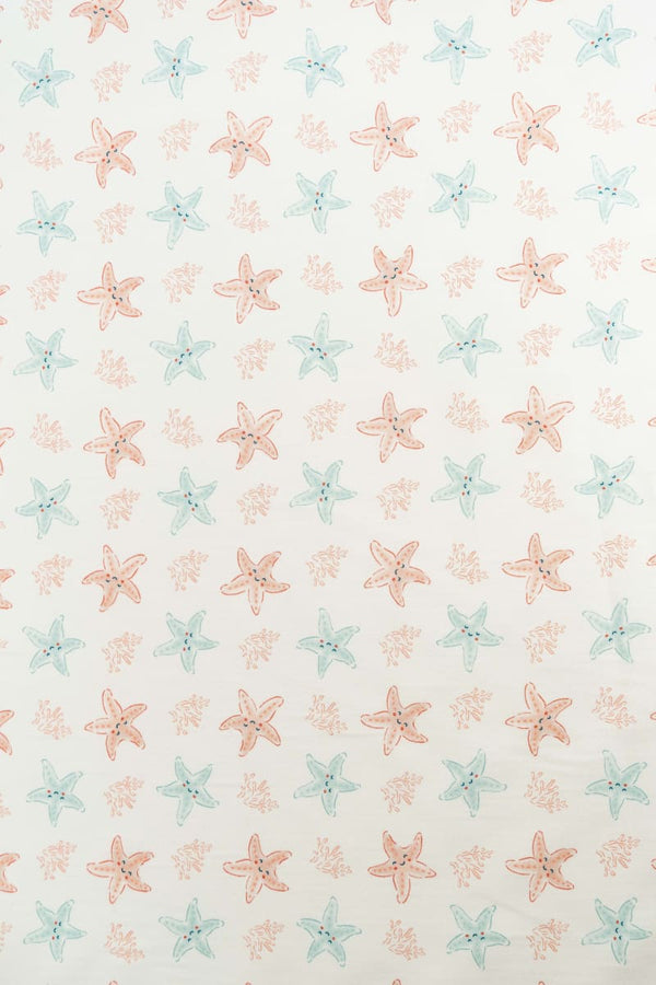 Tejido infantil con estampado de estrellas de mar