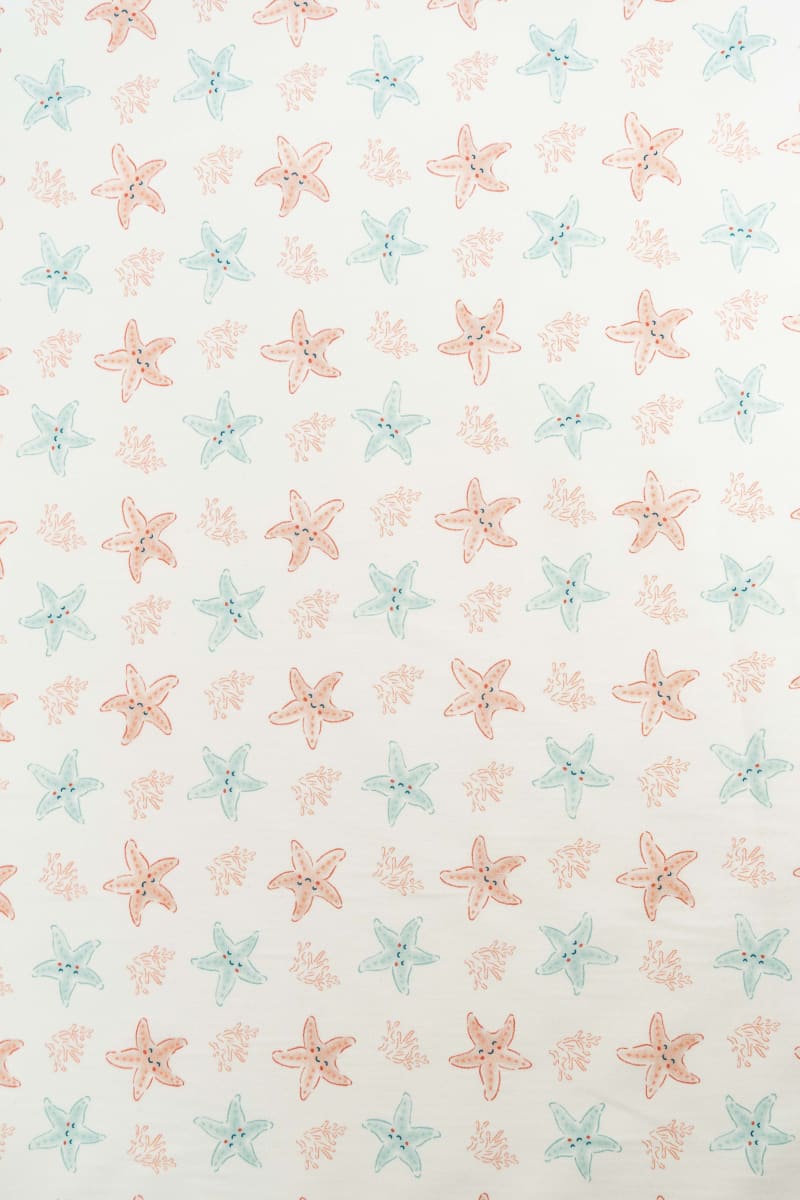 Tejido infantil con estampado de estrellas de mar