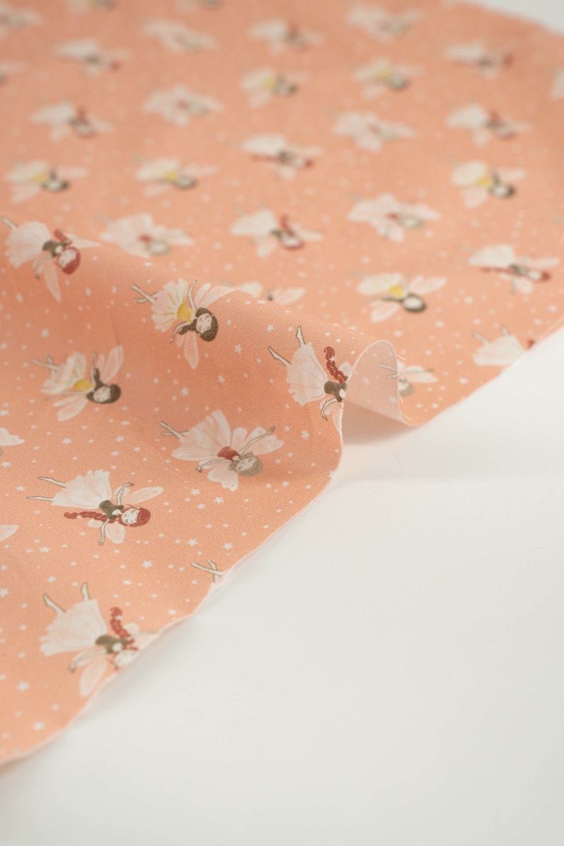 Tejido infantil con estampado de hadas