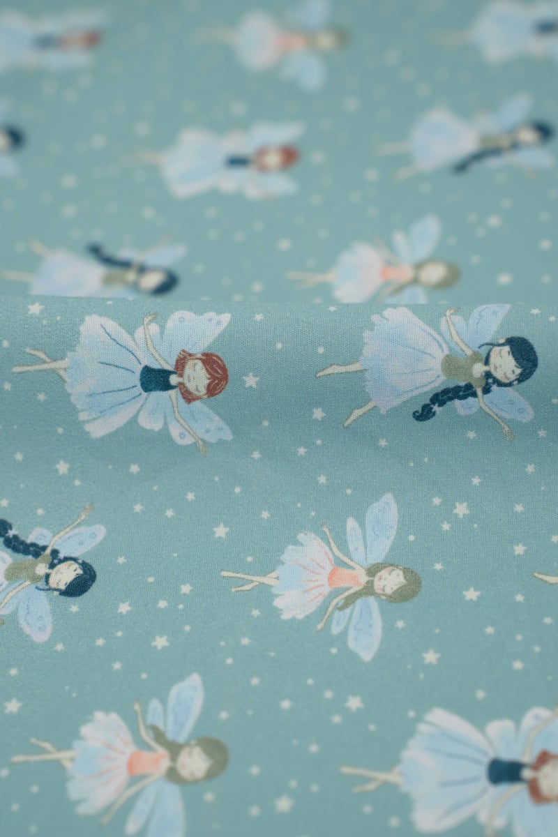 Tejido infantil con estampado de hadas