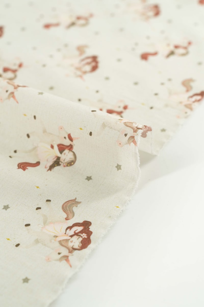 Tejido infantil con estampado de unicornios