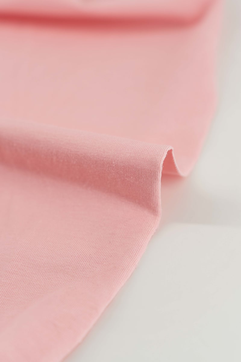 tela de punto de algodón en color rosa bebé